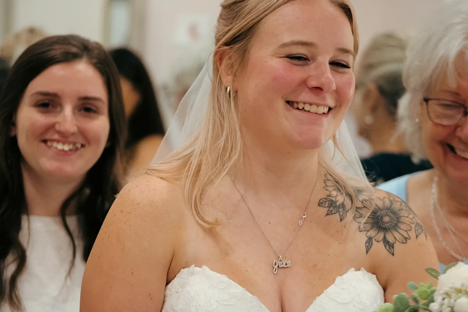 image shows a woman wearing a strapless bridal gown 