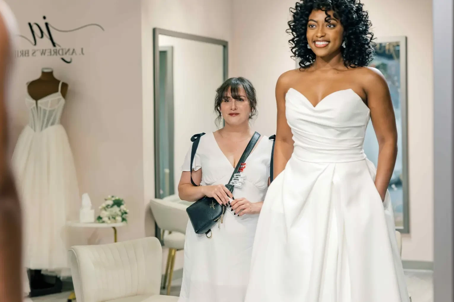 Сouple wearing a white gown and a black suit