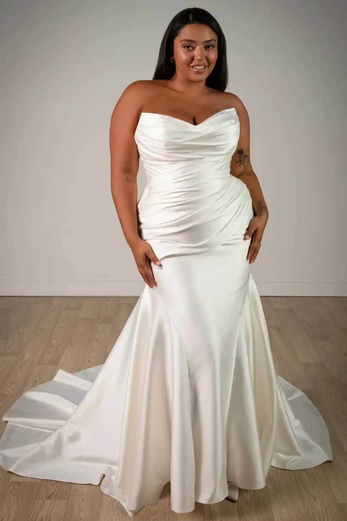model wearing a plus size wedding gown