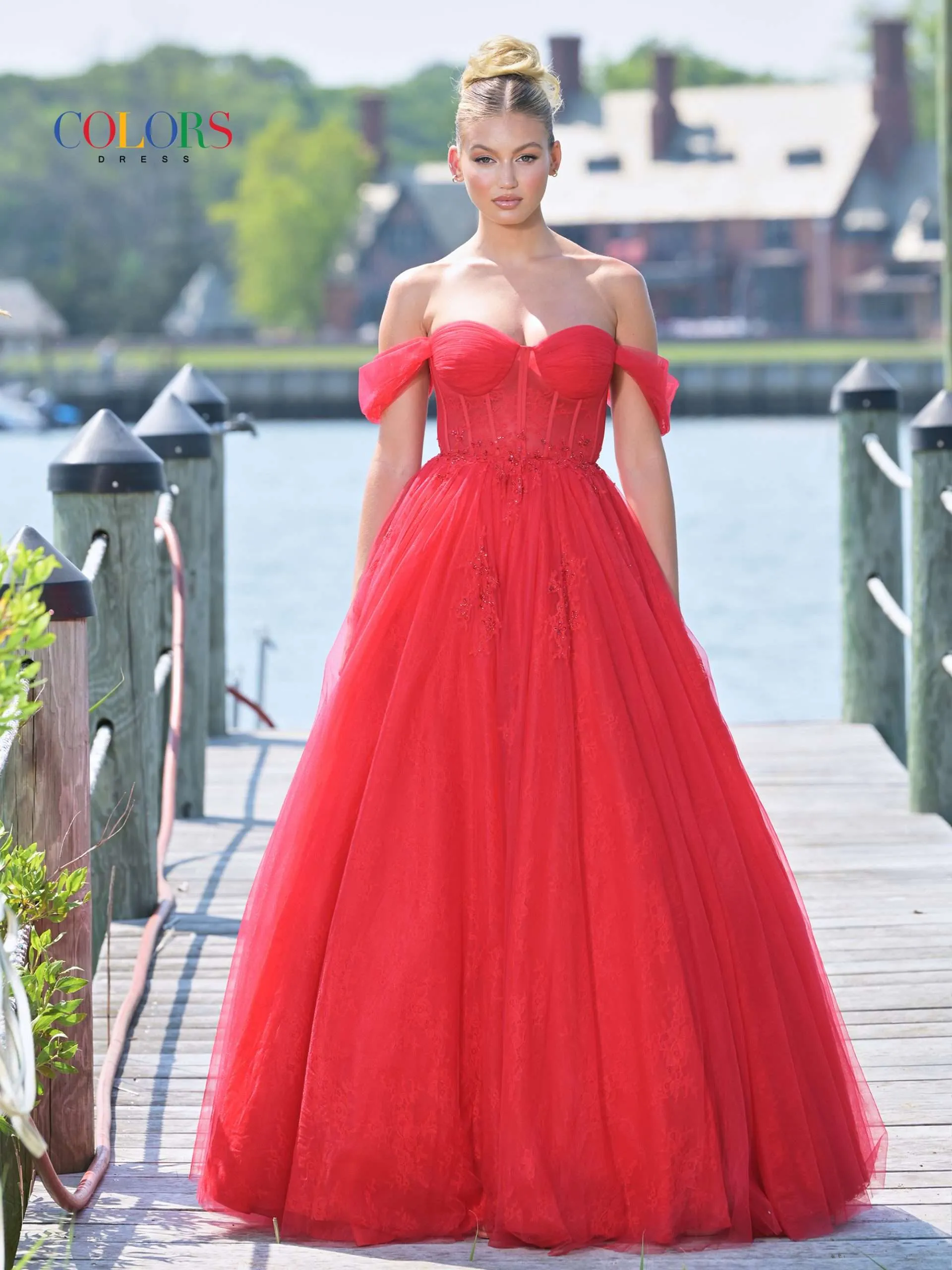 image shows a model wearing a red off the shoulder wedding dress inspired by taylor swift's red era 