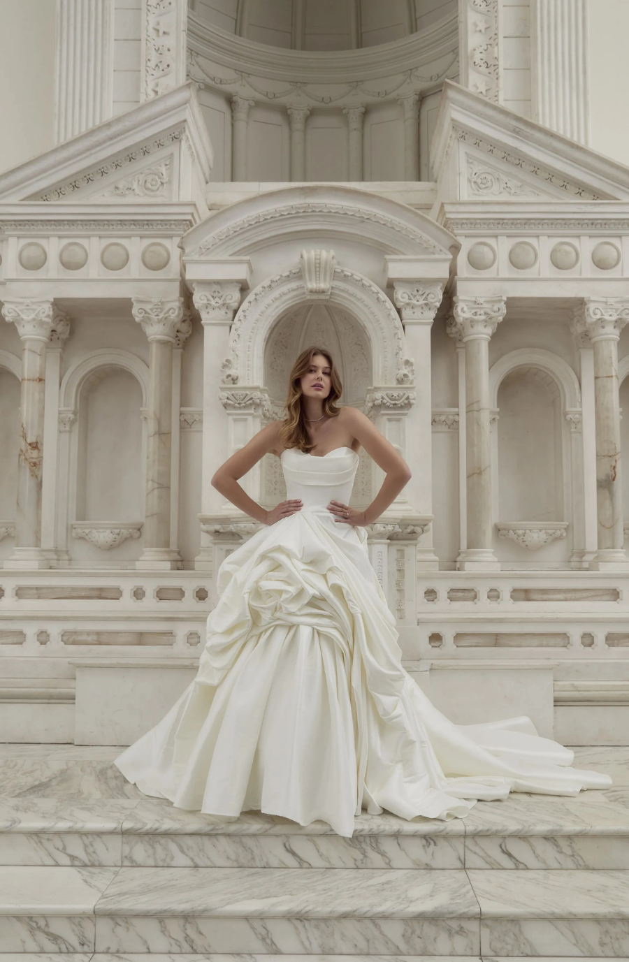 model is wearing a ball gown wedding dress inspired by the tortured poets department by taylor swift