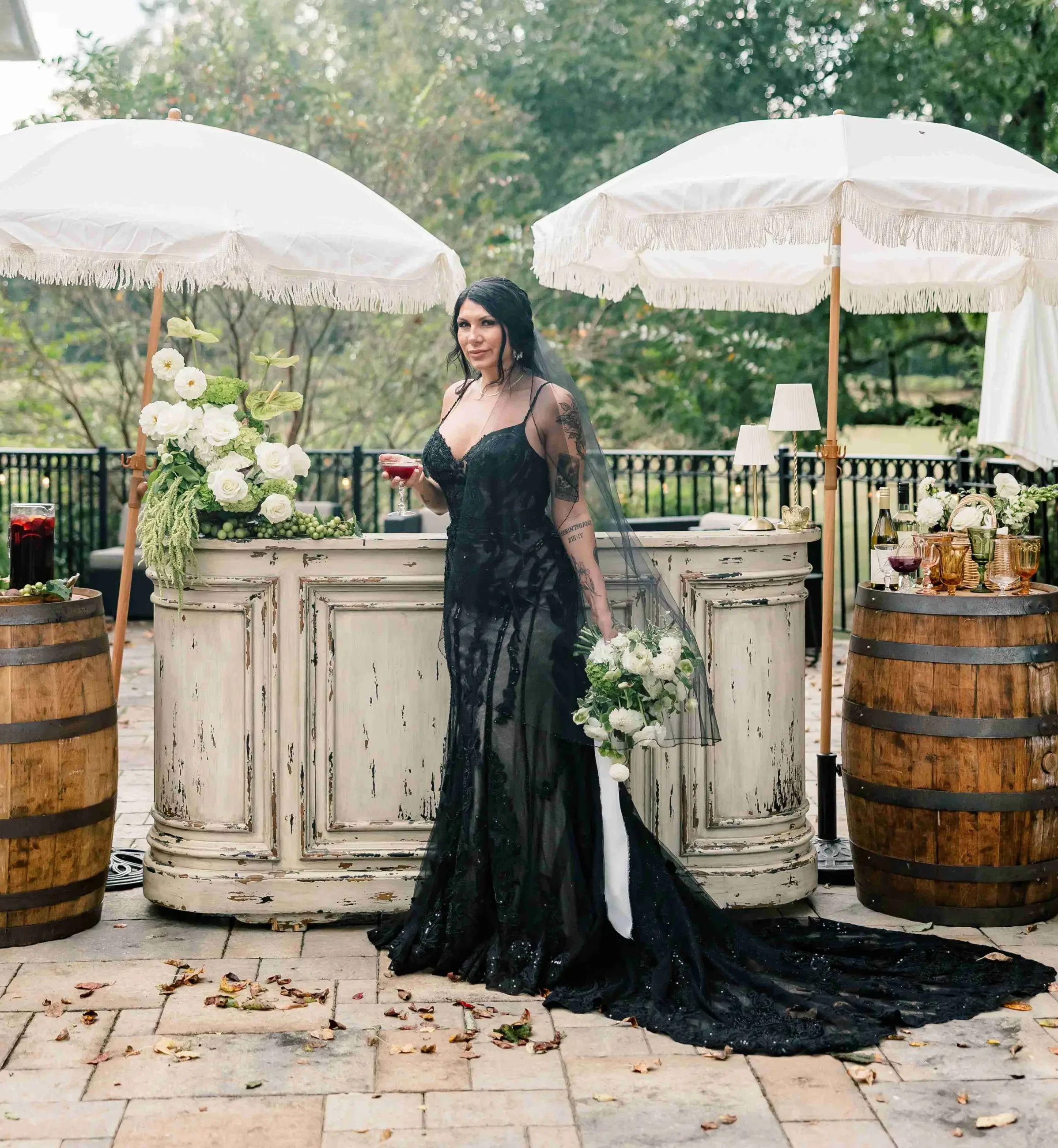 model wearing black wedding gown in vineyard